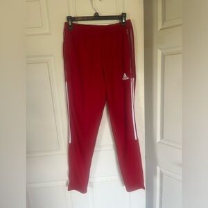 Red with white stripes medium men’s adidas track pants.